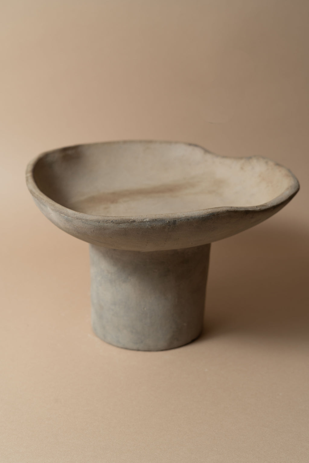 Terracotta pedestal bowl with a tall foot
