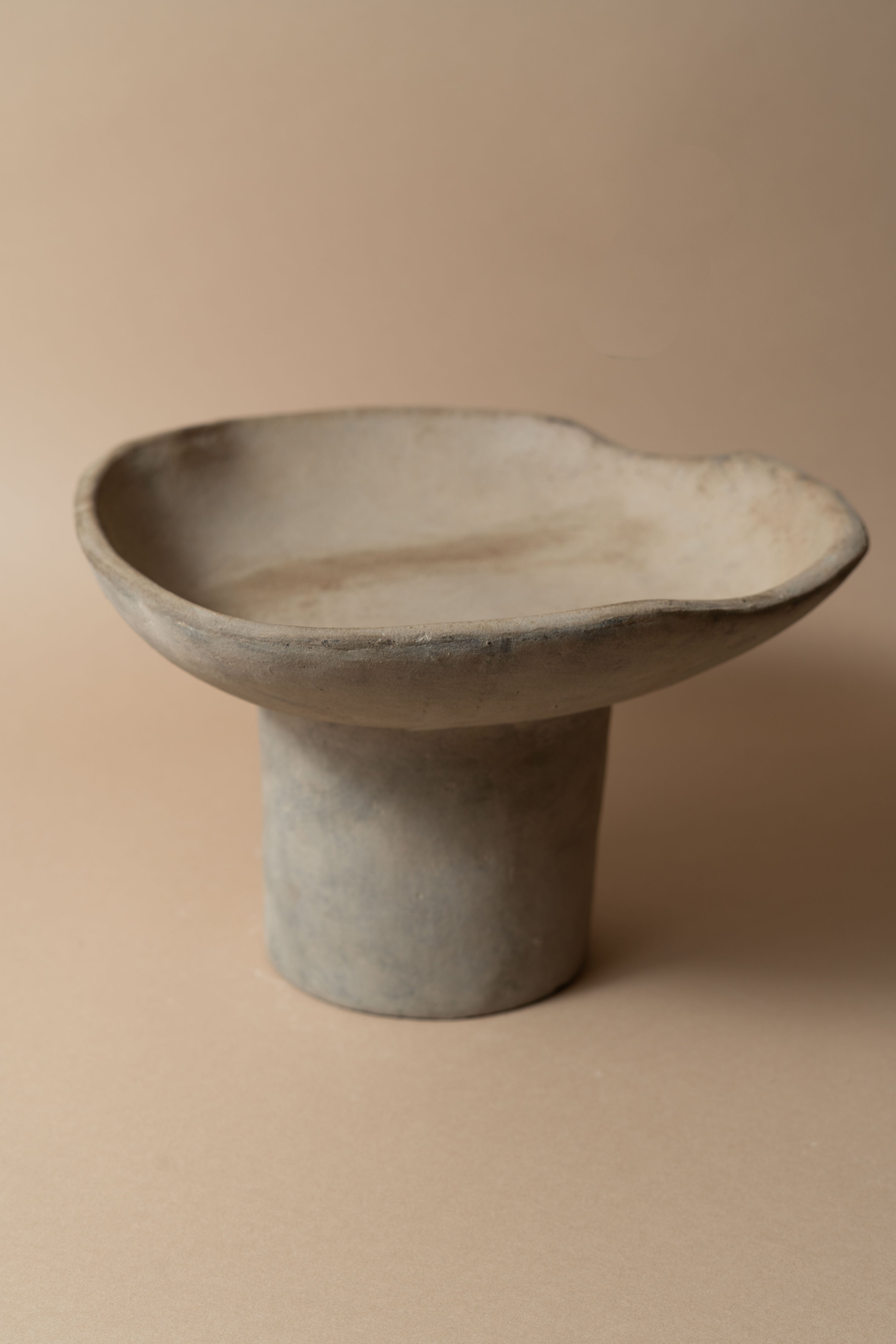 Terracotta pedestal bowl with a tall foot