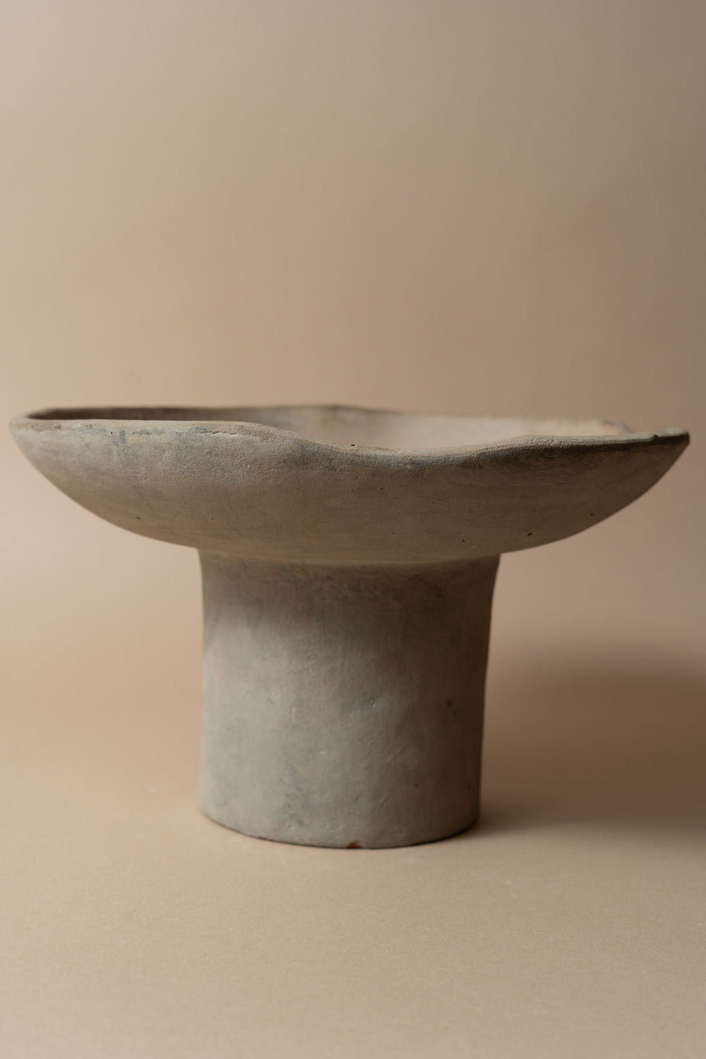 Terracotta pedestal bowl with a tall foot